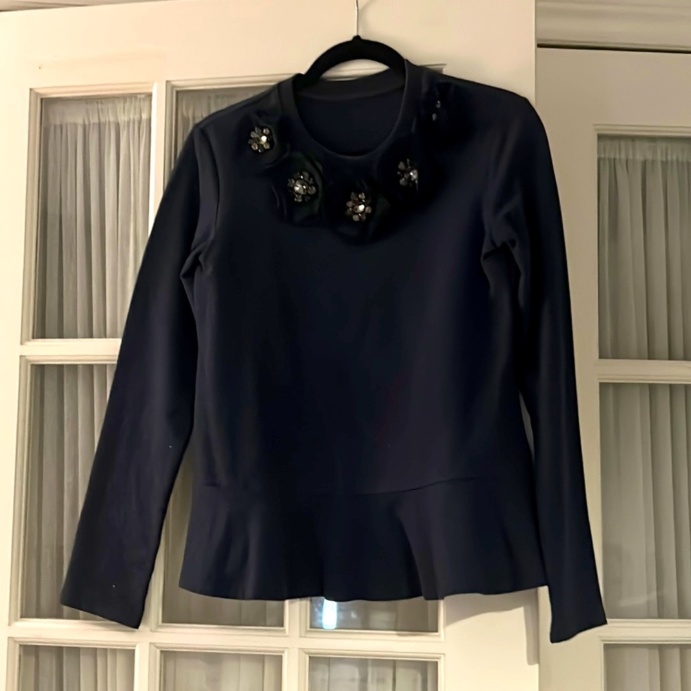 Cozy and comfy navy blue sweater decorated with mini tule flower and small gems.